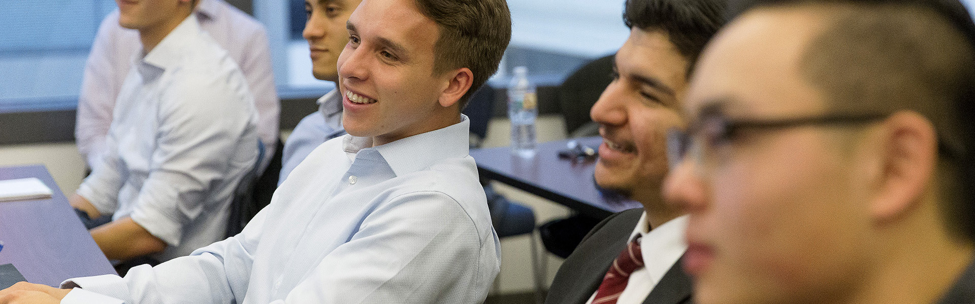 Group of male students paying attention in class