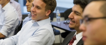 Group of male students paying attention in class