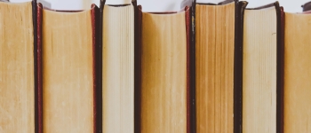 Stack of closed books on a shelf